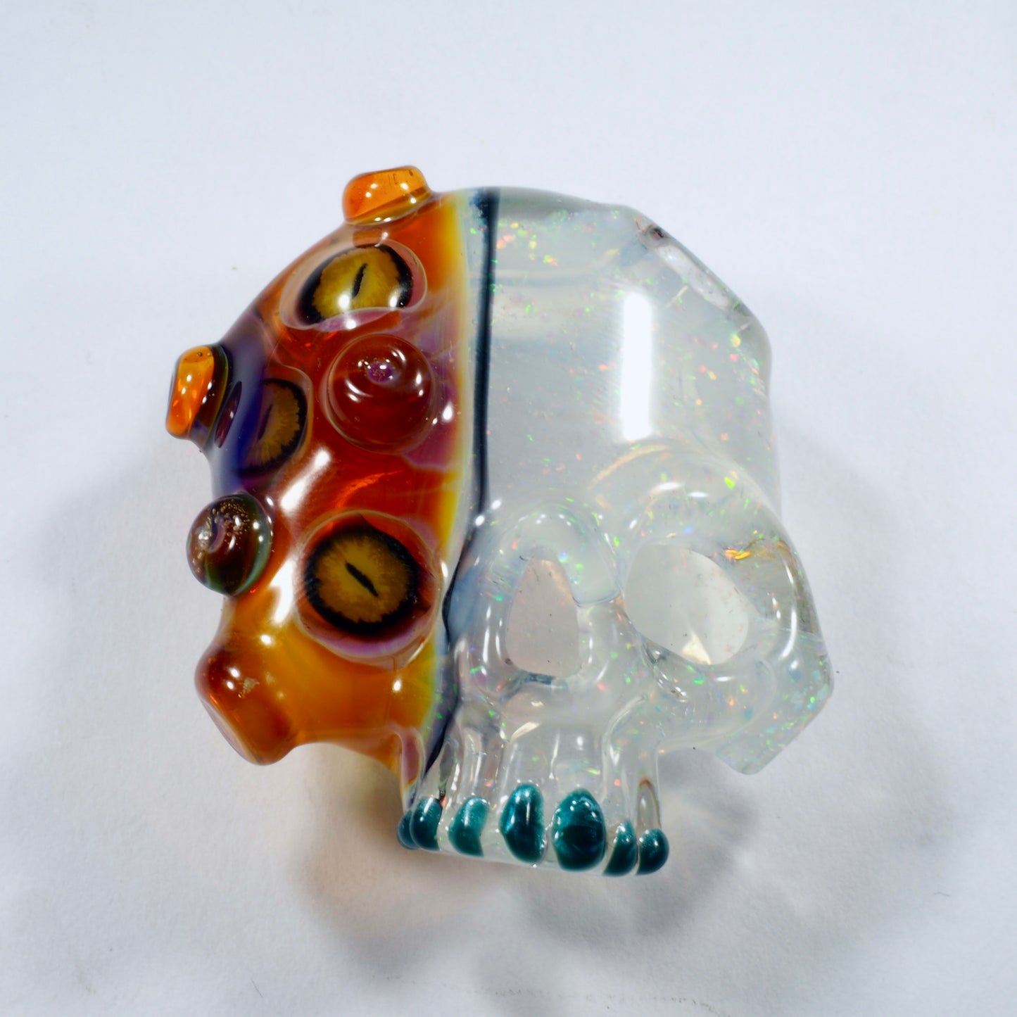 Two Faced Skulls by Warwick Glass - Purple Amber UV Snake Eyes Pendant