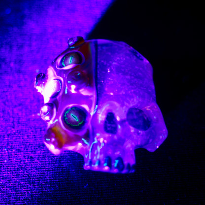 Two Faced Skulls by Warwick Glass - Purple Amber UV Snake Eyes Pendant