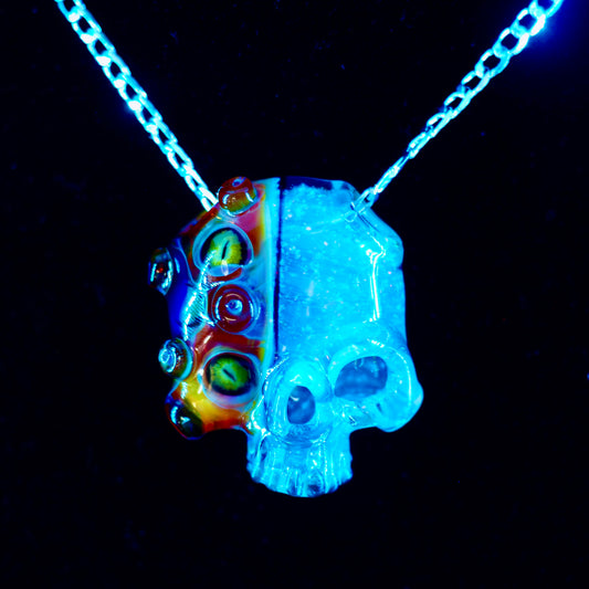 Two Faced Skulls by Warwick Glass - Purple Amber UV Snake Eyes Pendant